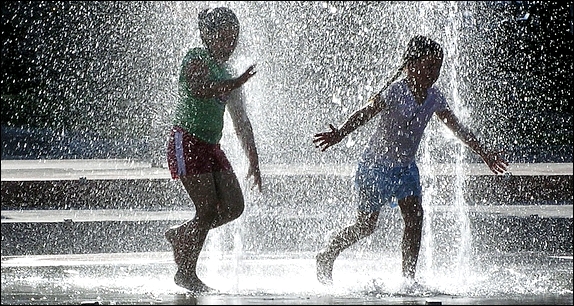 children playing in a fountain